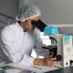 a man wearing a white lab coat