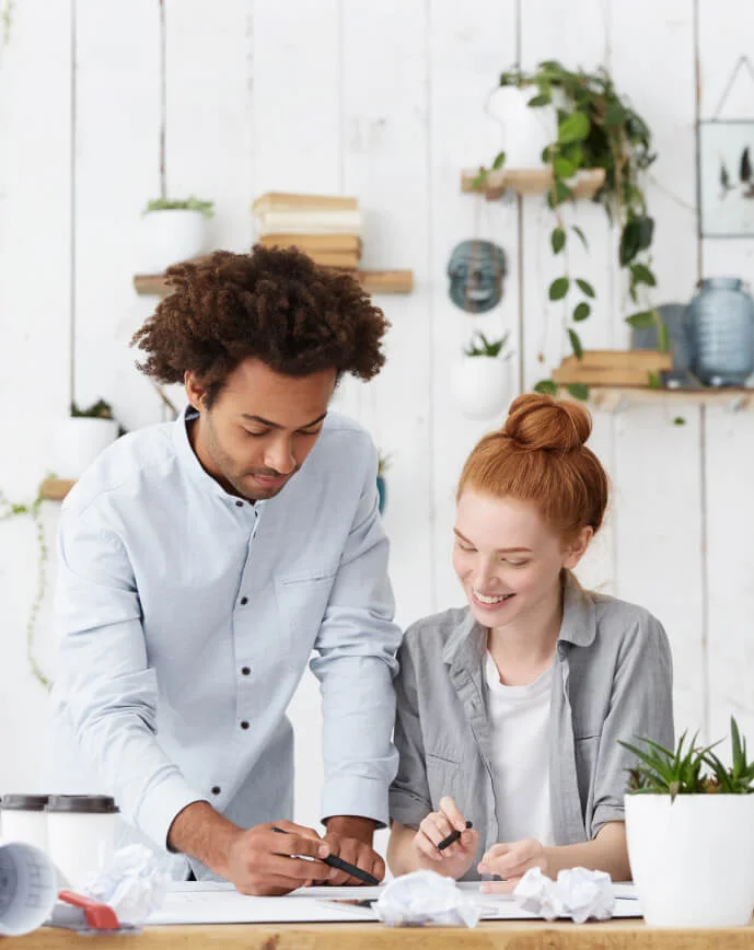 a person and a child looking at a tablet